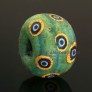 Large Hellenistic green glass bead with mosaic cane eyes  294EA